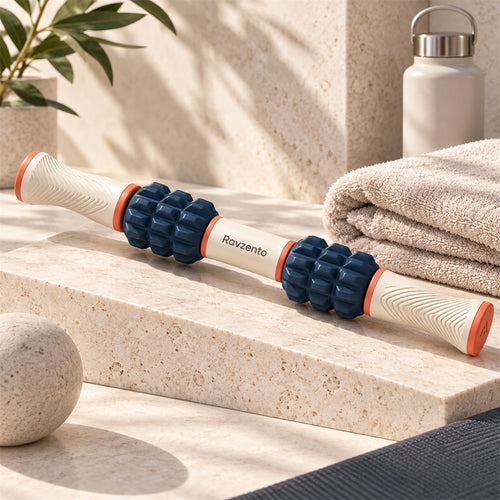 Ravzento dual-handle muscle roller on a warm studio surface